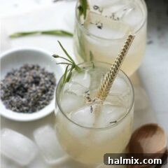 overhead view of lavender lemonade with gold straws