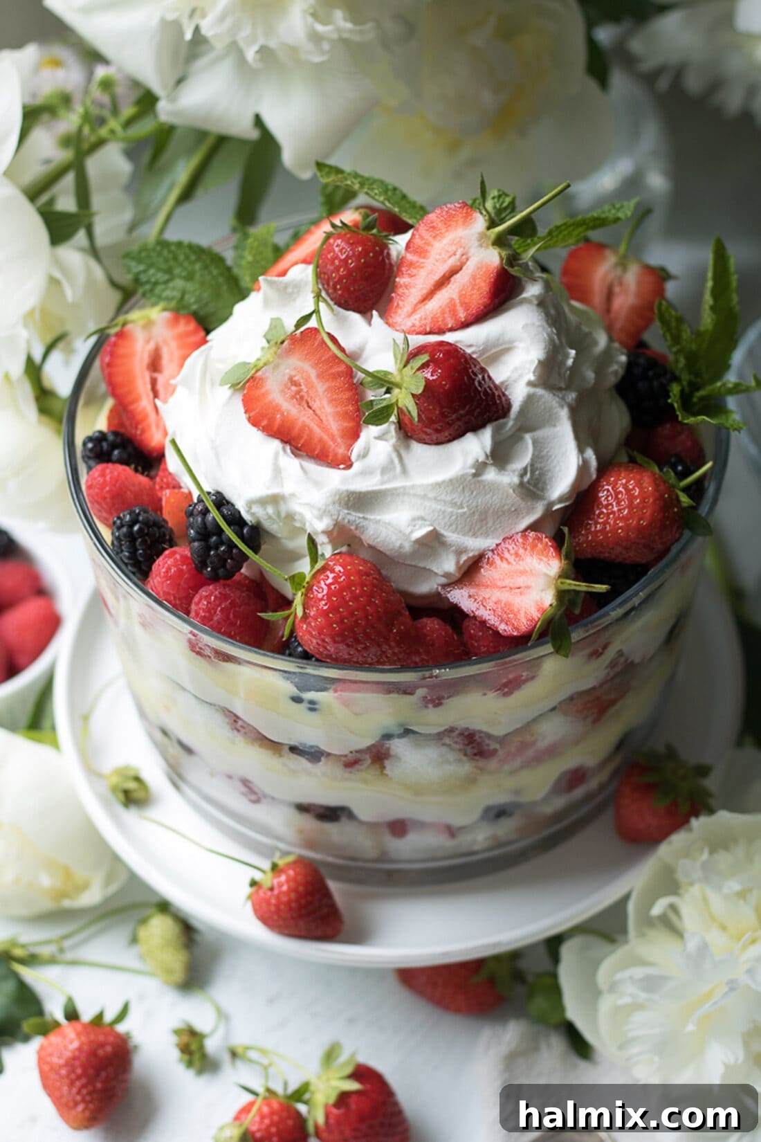 Top view of a Mixed Berry Trifle, beautifully garnished with fresh berries and whipped cream.
