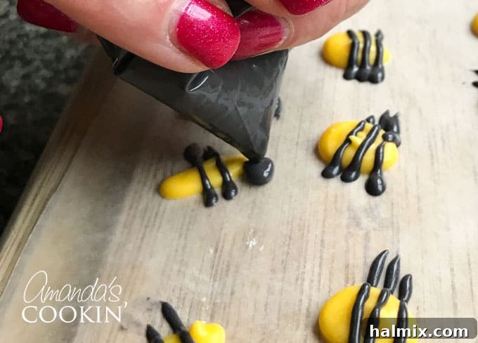 Golden Bee Treat Toppers 5 Adding black candy melt details to yellow bee bodies