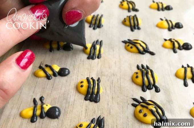 Golden Bee Treat Toppers 6 Adding black eyes to candy melt bee cupcake toppers