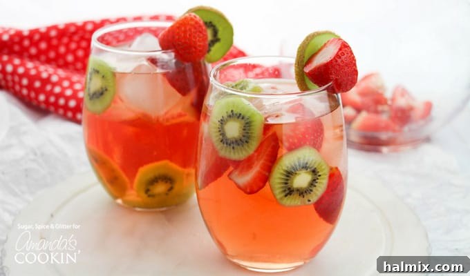 Strawberry Kiwi Sangria garnished with fresh fruit and ready to be served.