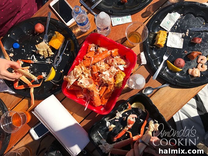 Food on a table including cracked crab legs
