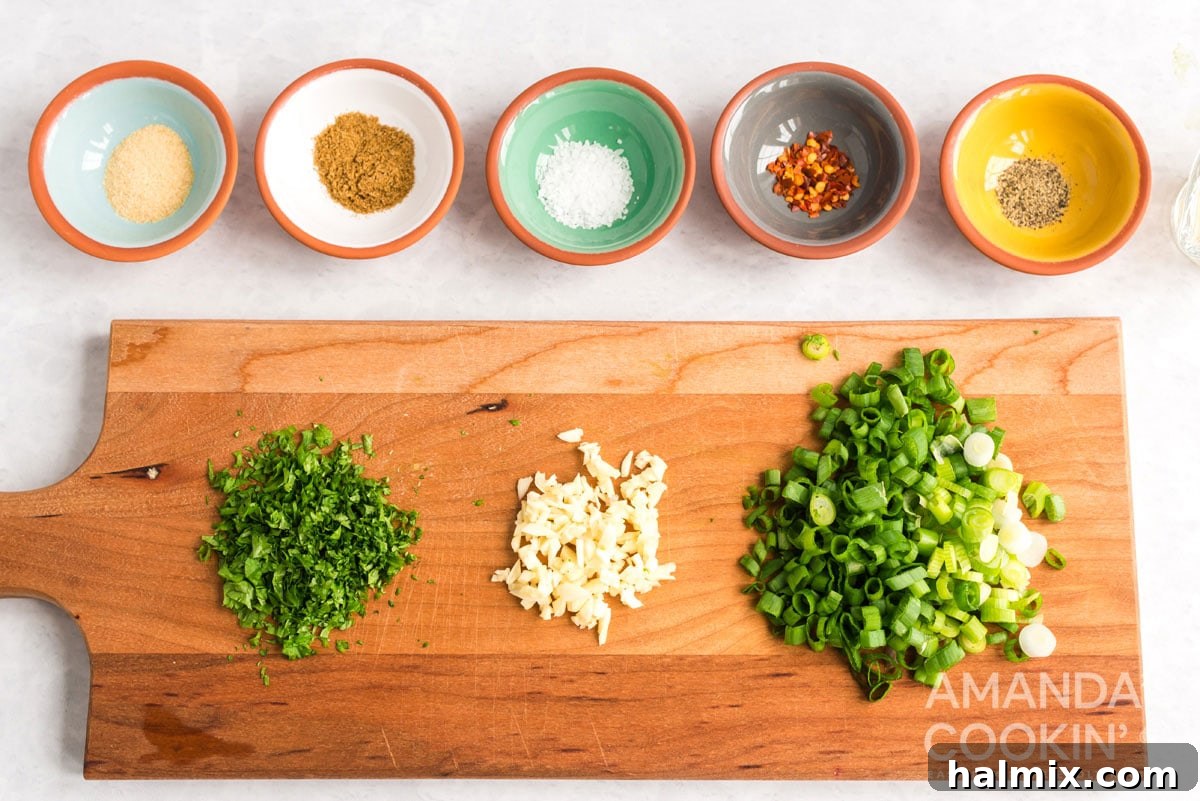 A close-up view of freshly minced cilantro and garlic, showcasing the vibrant green and white on a cutting board, essential for aromatic salsa.