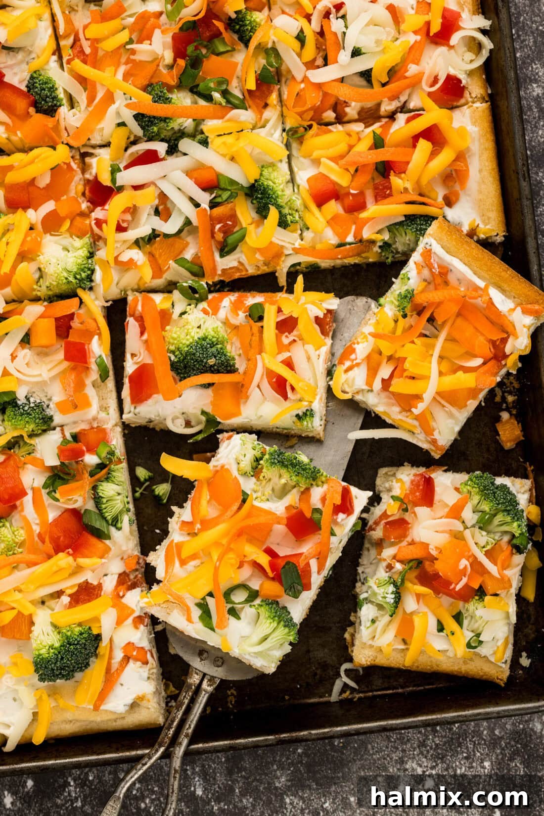 Vibrant Garden Pizza Bites 2 Close up photo of Appetizer Veggie Pizza slices on a pan