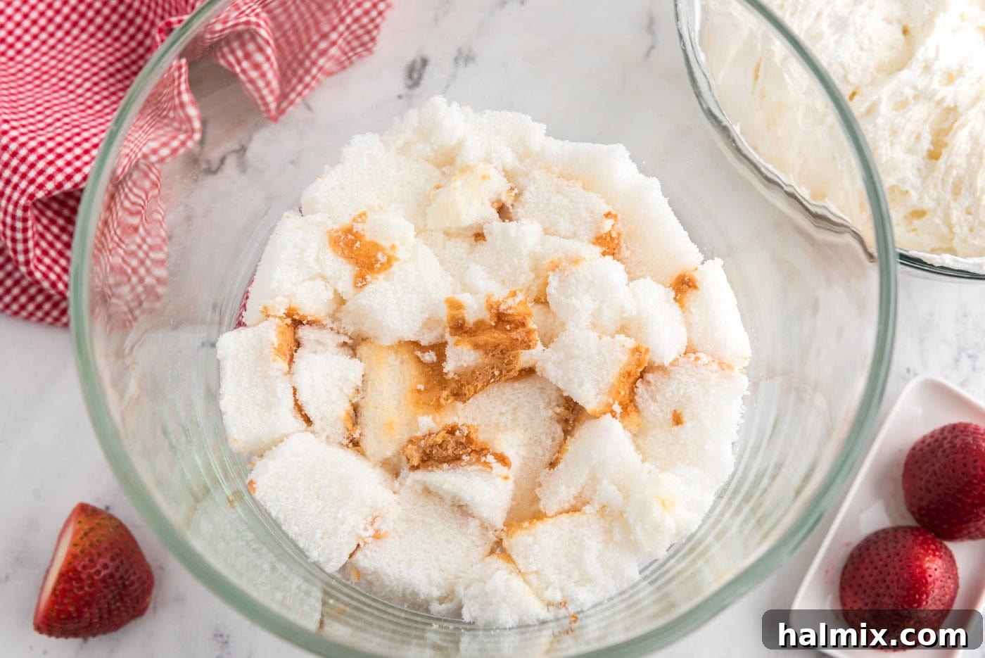 cubed angel food cake in a trifle bowl