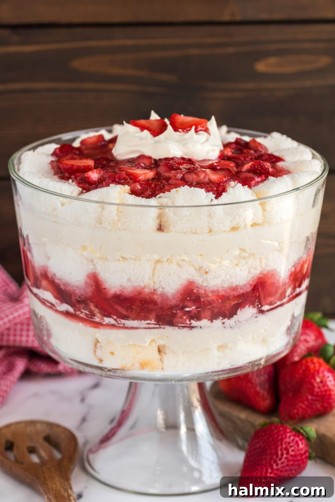 Strawberry Shortcake Trifle with strawberries in the background