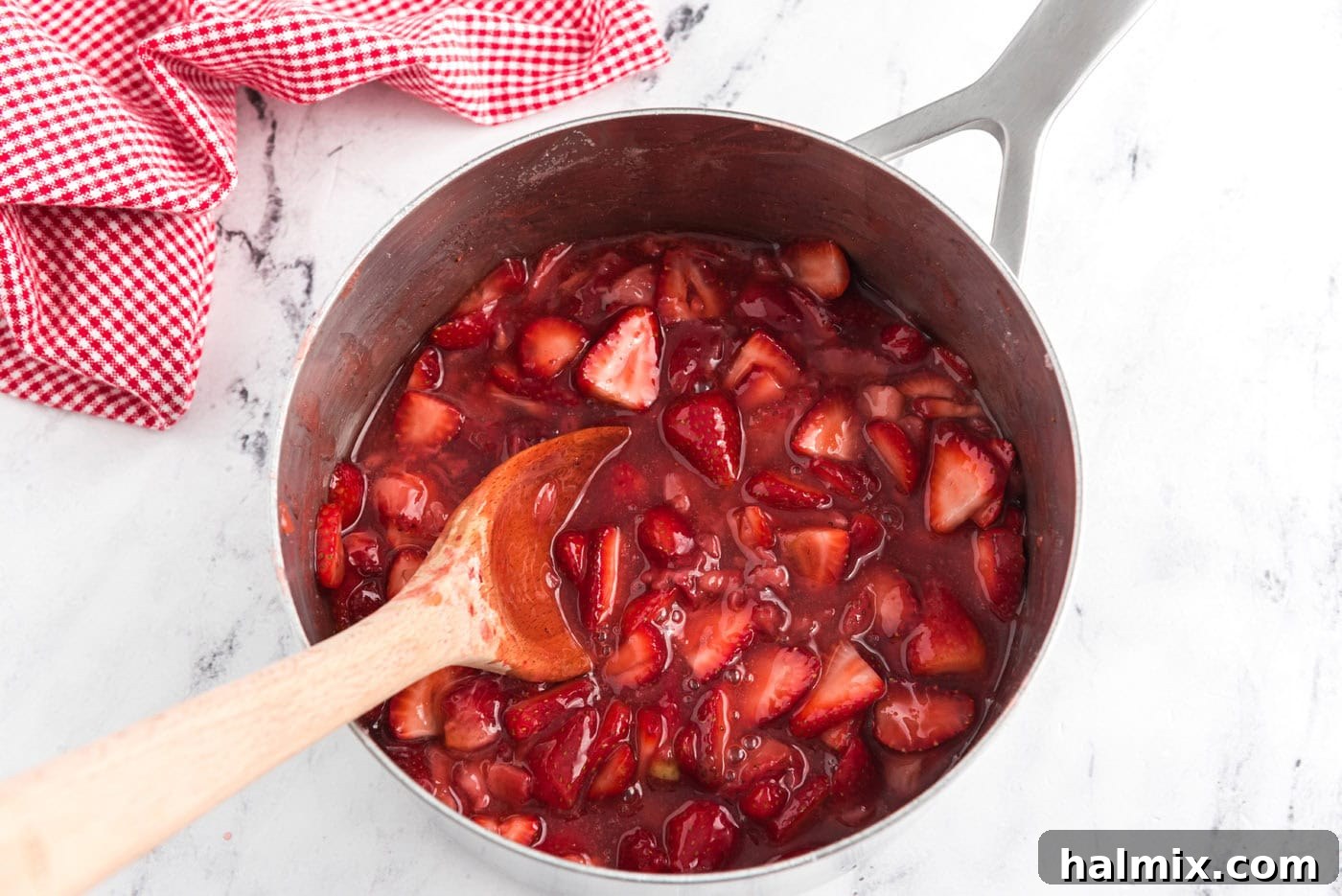 homemade macerated strawberry sauce in a saucepan