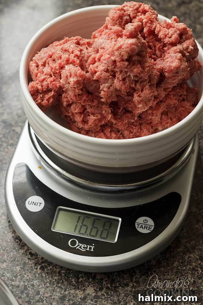 ground beef getting weighed on kitchen scale