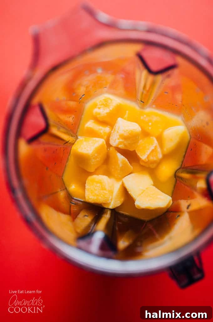Frozen mangos in a blender