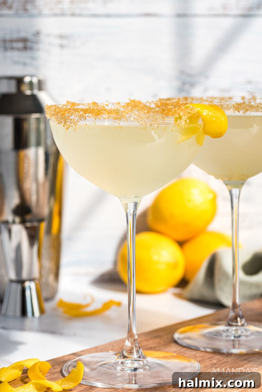 A beautifully presented Lemon Drop Cocktail in a martini glass, garnished with a lemon twist and sugared rim.