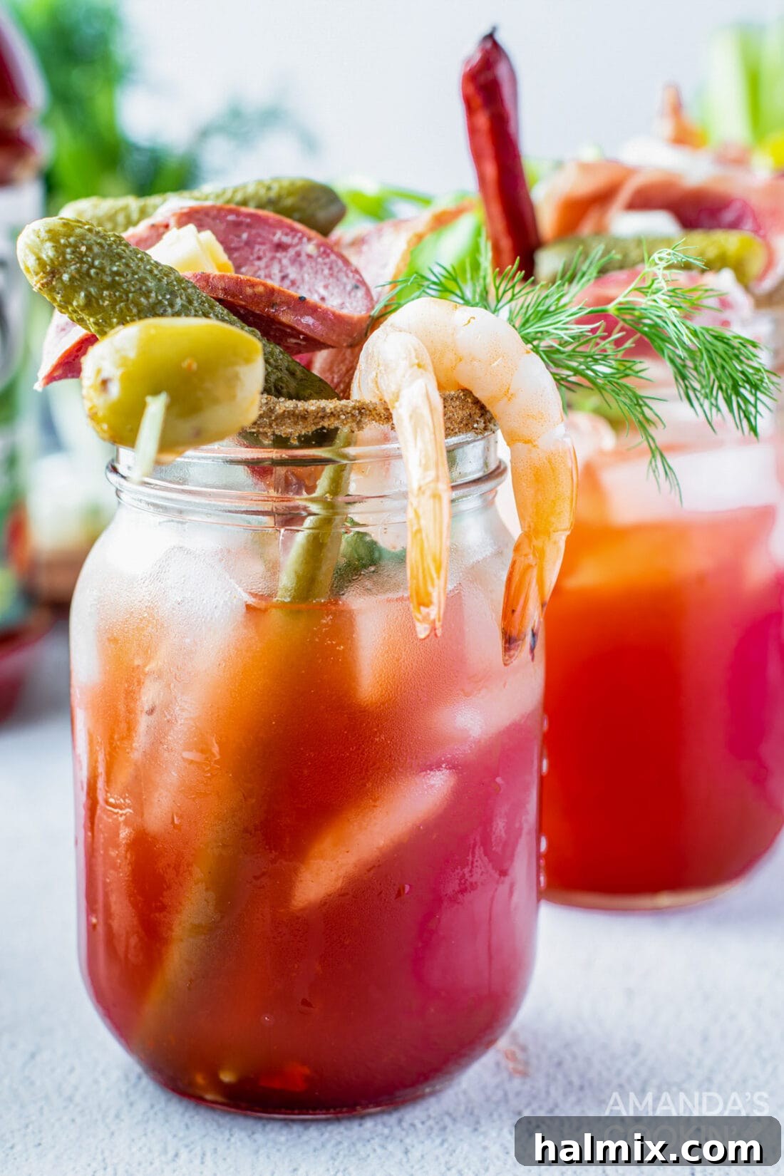 Say Her Name 11 bloody mary drink with olive, pickle, sausage, cheese, and shrimp, featuring a variety of garnishes