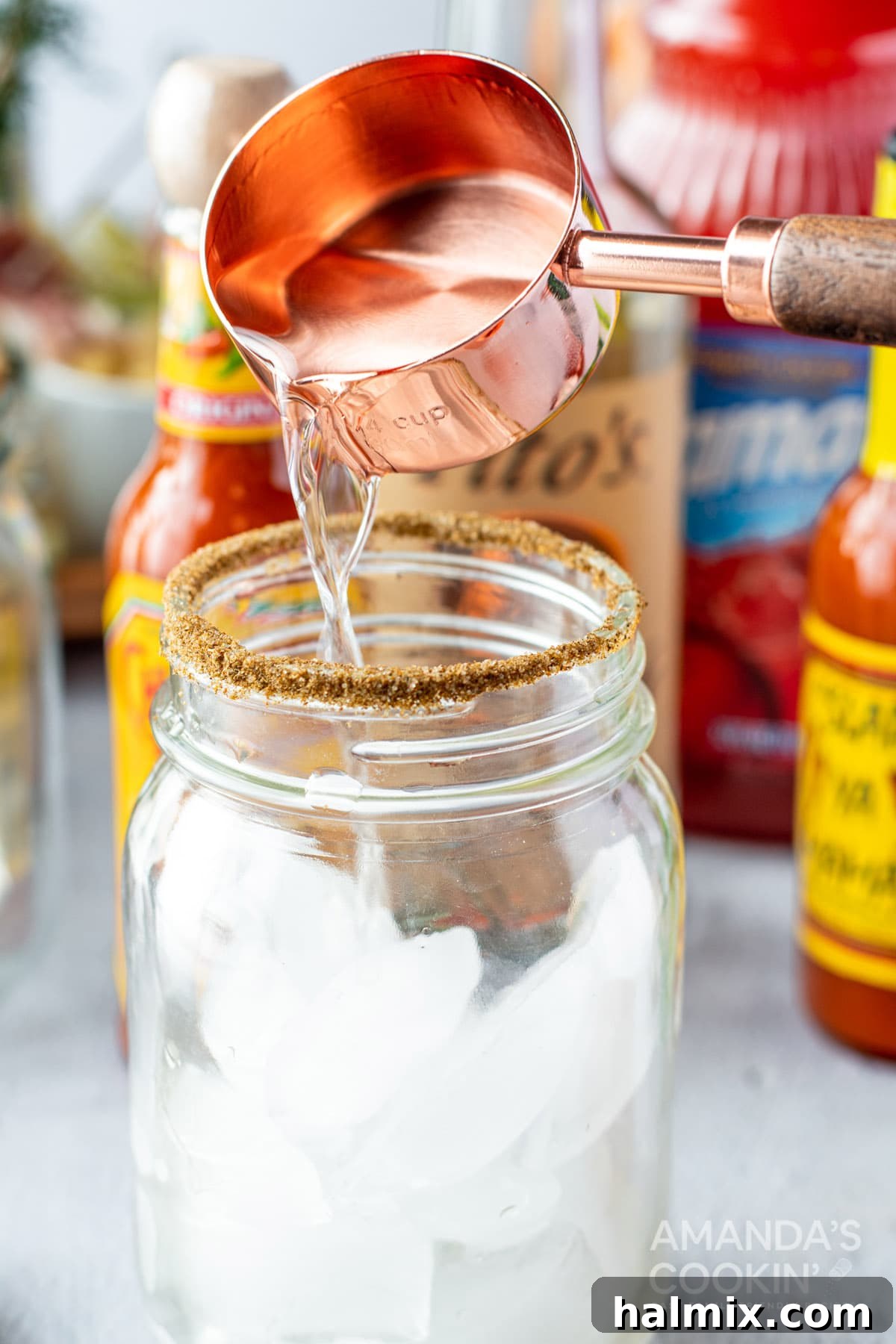 Say Her Name 5 adding vodka to glass for Bloody Mary