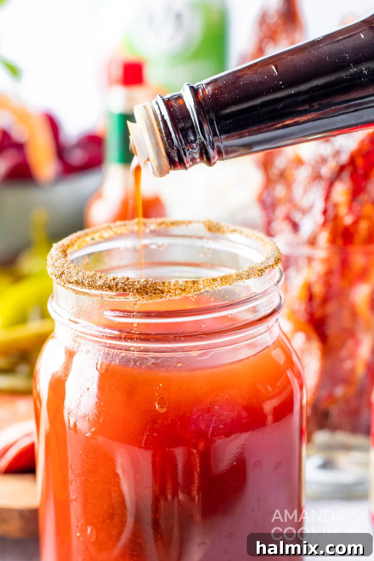 Say Her Name 7 adding Worcestershire sauce to Bloody Mary glass