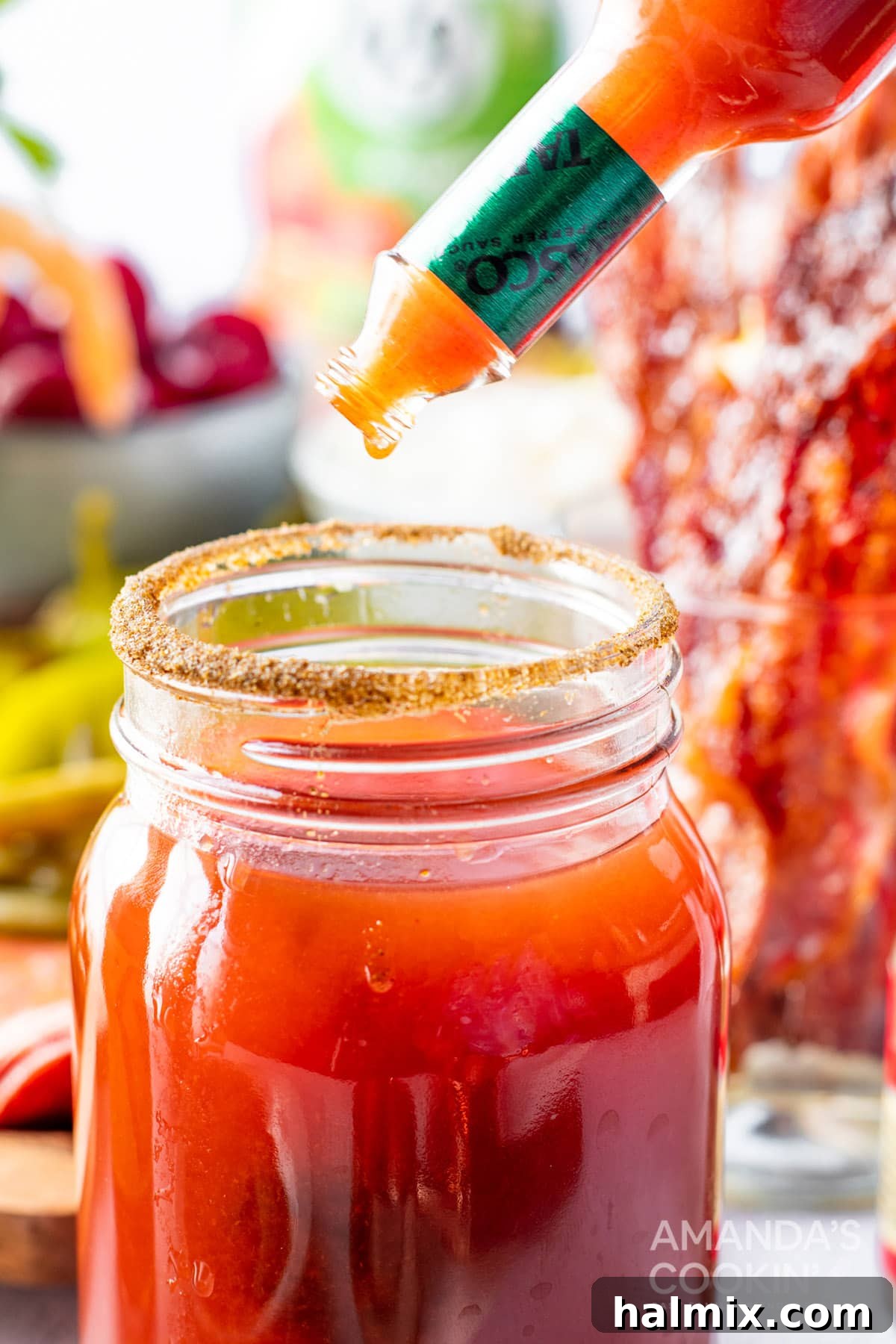 Say Her Name 8 adding hot sauce to Bloody Mary glass