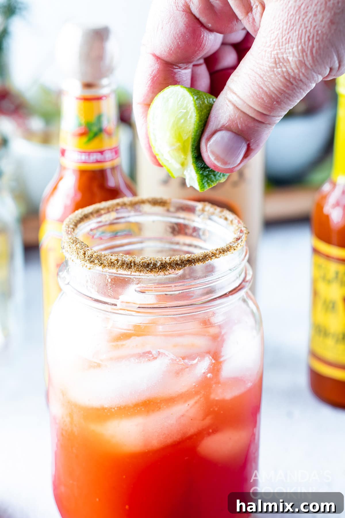 Say Her Name 9 squeezing lime over Bloody Mary glass