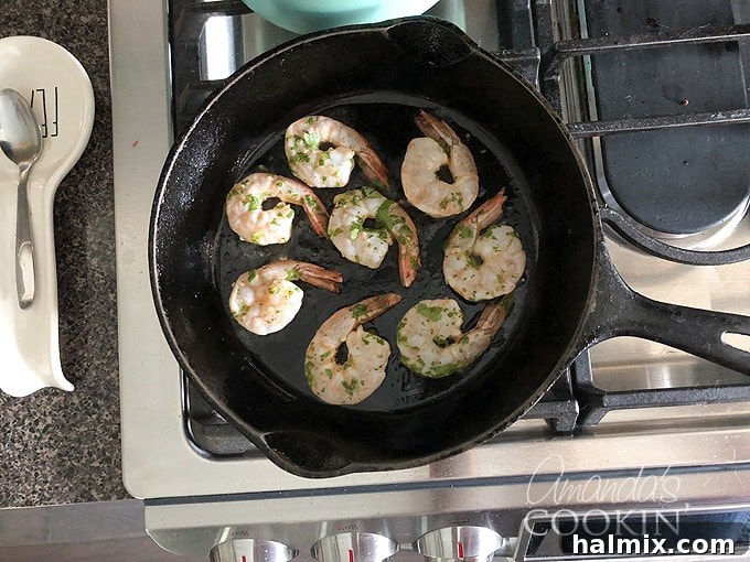 Zesty Prawn Sizzle 6 cooking shrimp in cast iron skillet