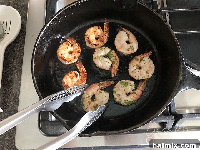Zesty Prawn Sizzle 7 turning shrimp in skillet