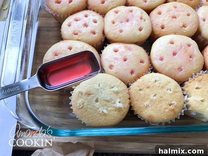 Watermelon Burst Cupcakes 4 Spoon dissolved Jell-O mixture over poked cupcakes