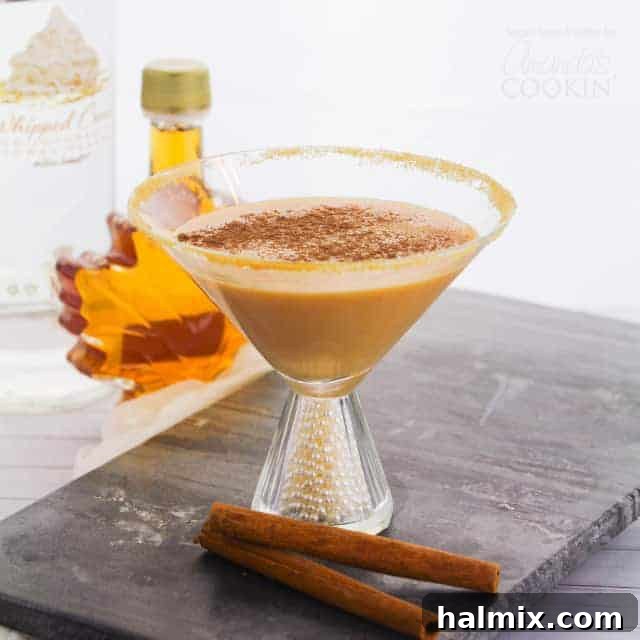 A close-up of a pumpkin martini, showcasing its creamy texture and rich color.