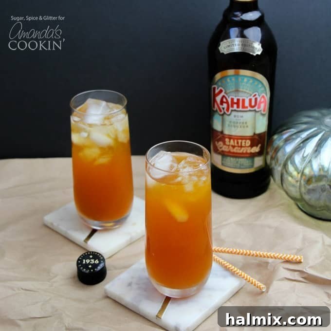 Two tall cocktails with Kahlua in the background, suggesting coffee-based drinks.