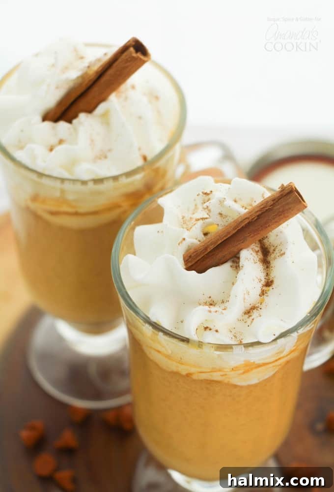 Pumpkin Spice Hot Chocolate with cinnamon stick garnish