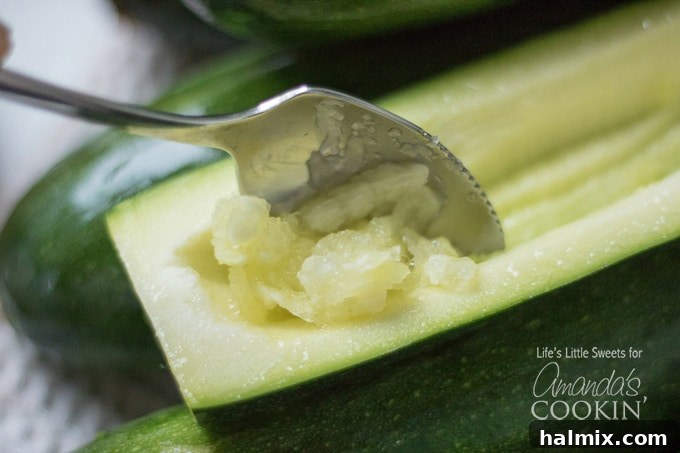 scooping pulp from zucchini