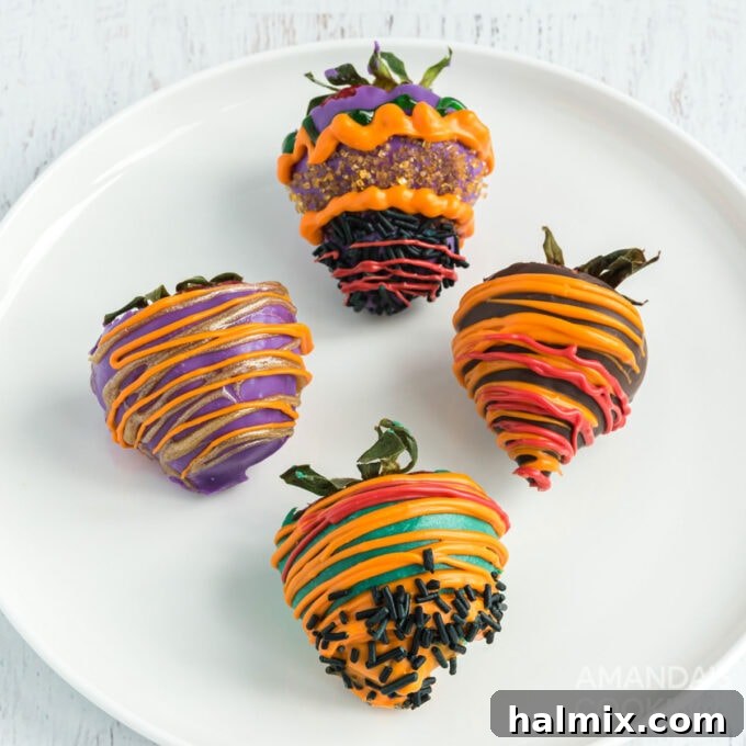 Wicked Halloween Bites 8 Halloween themed chocolate covered strawberries with sprinkles on a plate