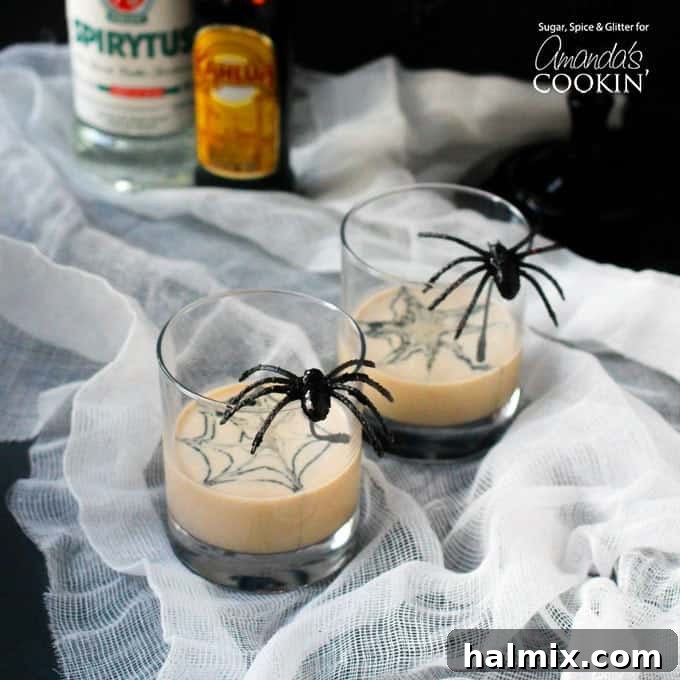If you need Halloween food ideas for your Halloween party, be sure to check out all these sweet, savory and beverage ideas! Something for everyone. Halloween Spiderweb Cream Cocktail in a fancy glass