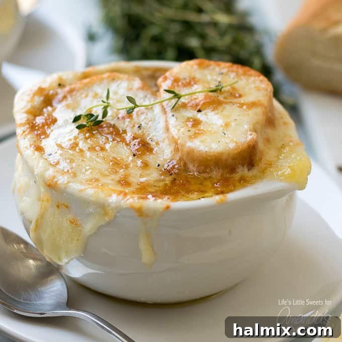 Comforting Slow Cooker Butternut Squash Soup 3 A bowl of classic French Onion Soup topped with a golden, cheesy crouton.
