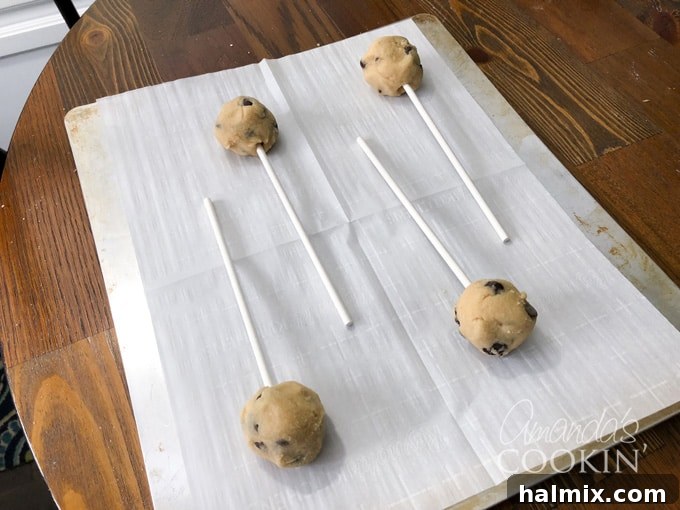 Ghoulish Gaze Cookie Pops 3 Lollipop sticks inserted into cookie dough balls