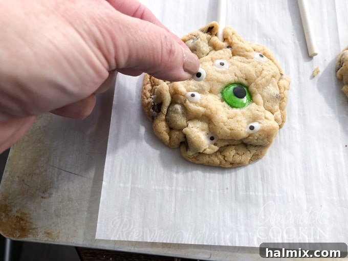 Ghoulish Gaze Cookie Pops 5 Adding candy eyeballs to hot baked cookies