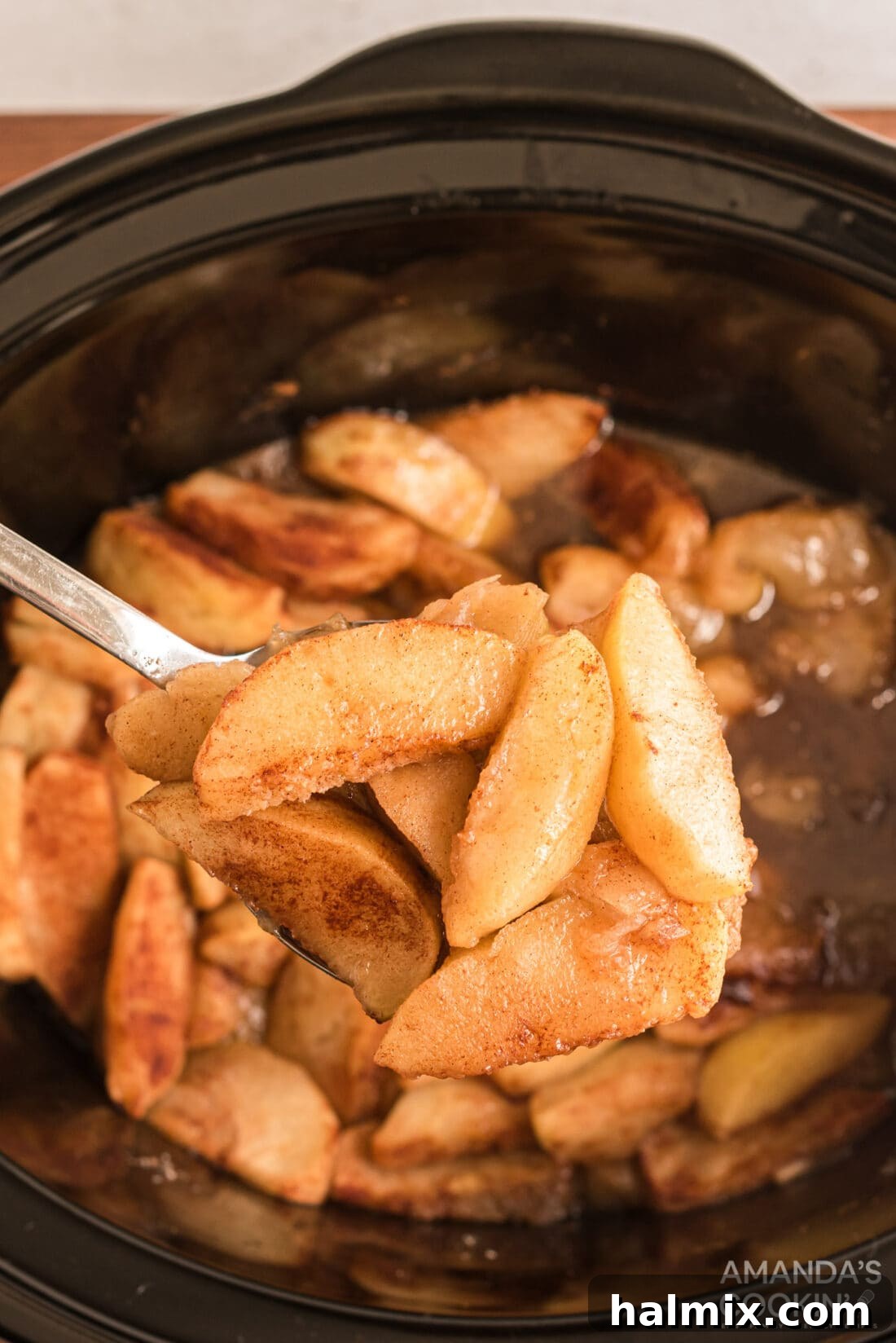 Slow-Cooked Apple Cinnamon Delight 2 spooning out some Crockpot Cinnamon Apples