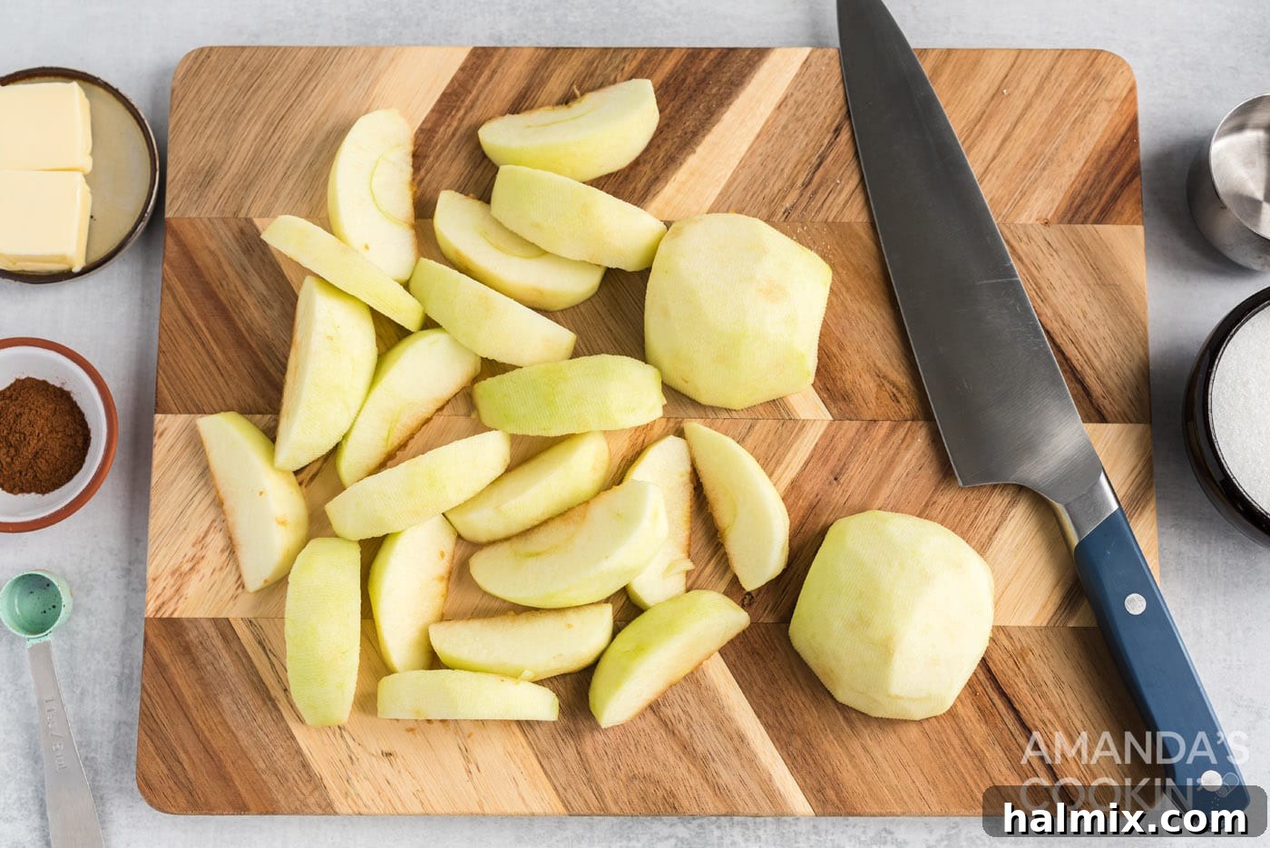 Slow-Cooked Apple Cinnamon Delight 5 sliced granny smith apples on cutting board