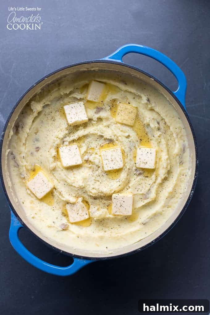 Velvety Mashed Potatoes 2 Overhead shot of creamy traditional mashed potatoes in a Dutch oven, inviting to serve.