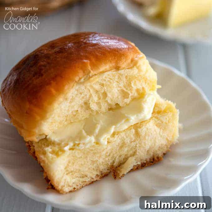 Close-up of delicious, soft, and sweet homemade Hawaiian Rolls on a cooling rack