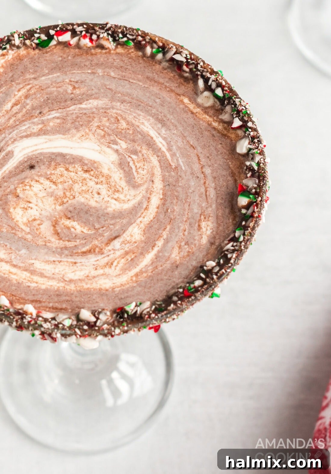 An overhead shot showcasing a beautifully garnished chocolate peppermint martini.