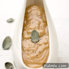 Close up photo of a gravy boat of Homemade Turkey Gravy