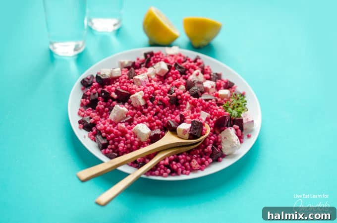 A single serving of Pearl Couscous Salad with Feta and Beets beautifully plated, highlighting its vibrant appeal.