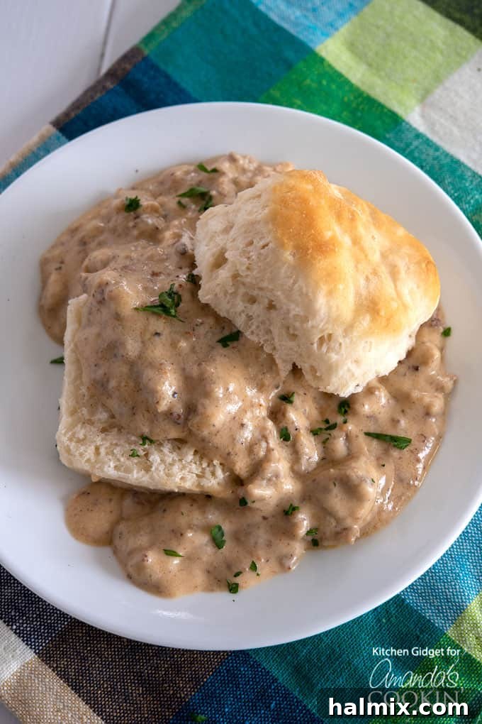 Classic Southern sausage gravy served hot over fluffy biscuits, ready for a delicious breakfast or brunch.
