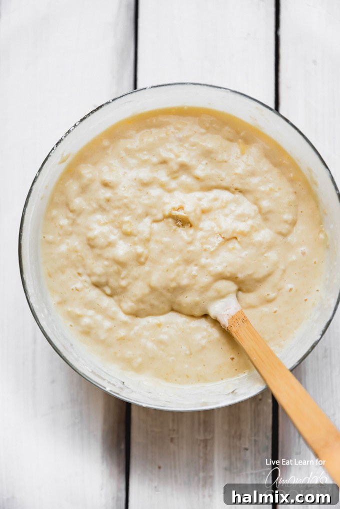 These classic buttermilk pancakes are fluffy, filling, and so delicious. Homemade pancakes are easier than you thought, so throw away that box mix! #breakfast #breakfastrecipes #buttermilkpancakes #pancakes #homemadepancakes The combined dry ingredients for homemade buttermilk pancakes in a mixing bowl, showing the consistency before wet ingredients are added.