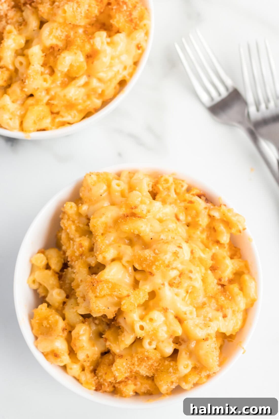 Golden-Crusted Macaroni Bake 12 Overhead shot of a large bowl of golden, creamy baked macaroni and cheese, topped with crispy breadcrumbs.
