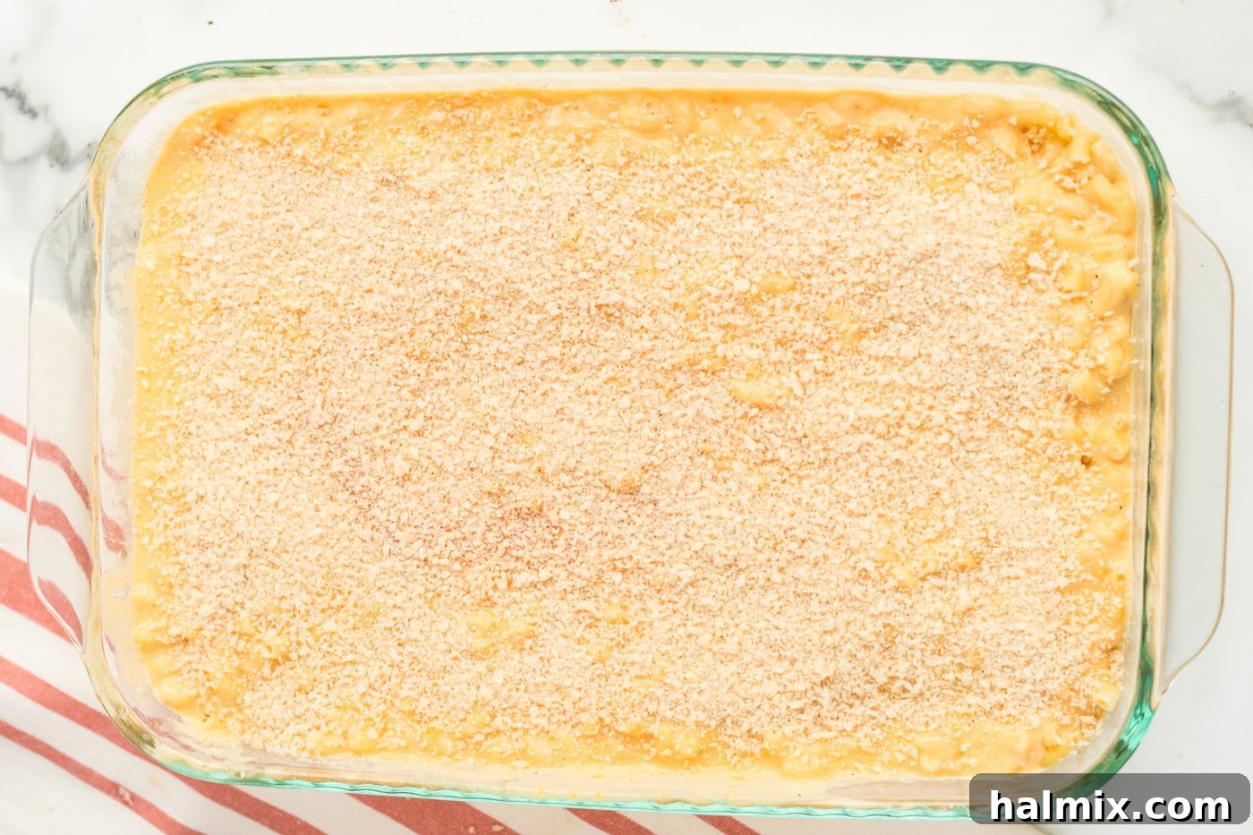 Golden-Crusted Macaroni Bake 10 The breadcrumb mixture perfectly spread over the macaroni and cheese in the baking pan, ready for the oven.