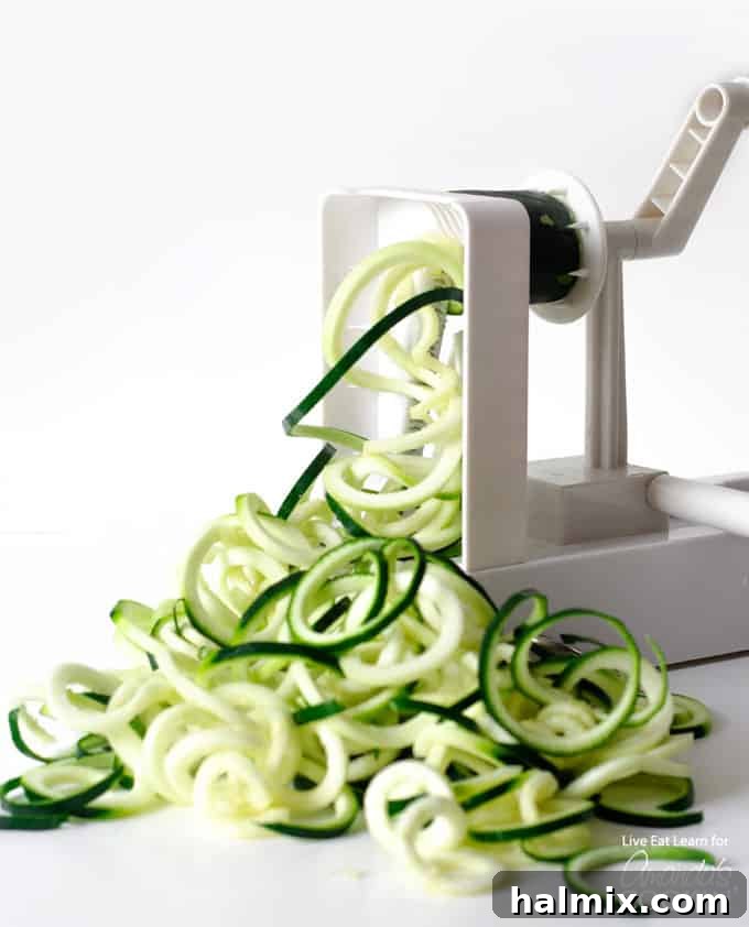 Zucchini noodles are a great low carb alternative to traditional pasta, and they’re so easy to make. Today we will show you how to make them at home! #zucchini #zucchininoodles #lowcarb #keto #lowcarbdinner #dinnerrecipes #vegetarian spiraling zucchini noodles