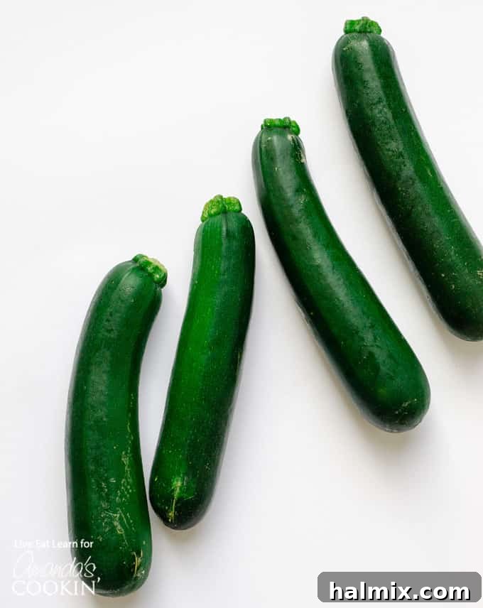 Zucchini noodles are a great low carb alternative to traditional pasta, and they’re so easy to make. Today we will show you how to make them at home! #zucchini #zucchininoodles #lowcarb #keto #lowcarbdinner #dinnerrecipes #vegetarian fresh, whole zucchini