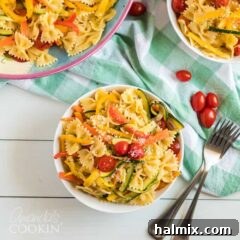 A beautifully presented bowl of Pasta Primavera, showcasing a medley of roasted vegetables and pasta, ready to be enjoyed.