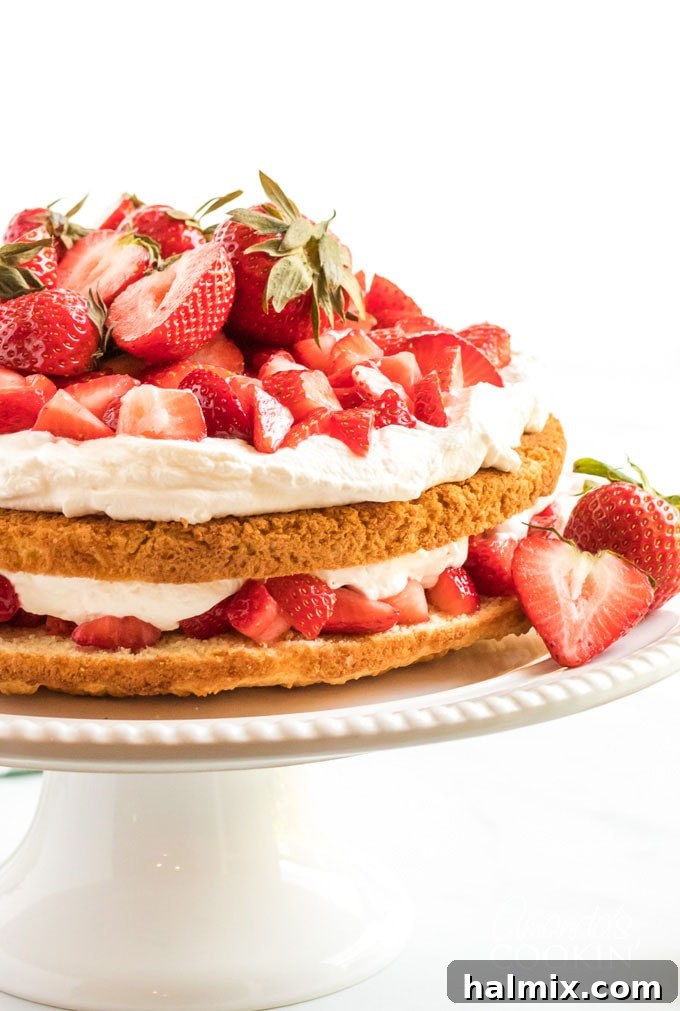 two layer strawberry shortcake on a cake plate