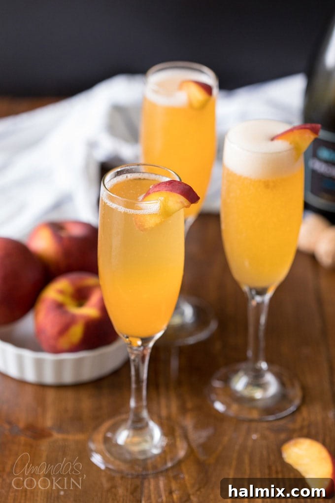 Three refreshing peach Bellinis in champagne flutes, ready to be enjoyed at a summer gathering or brunch.