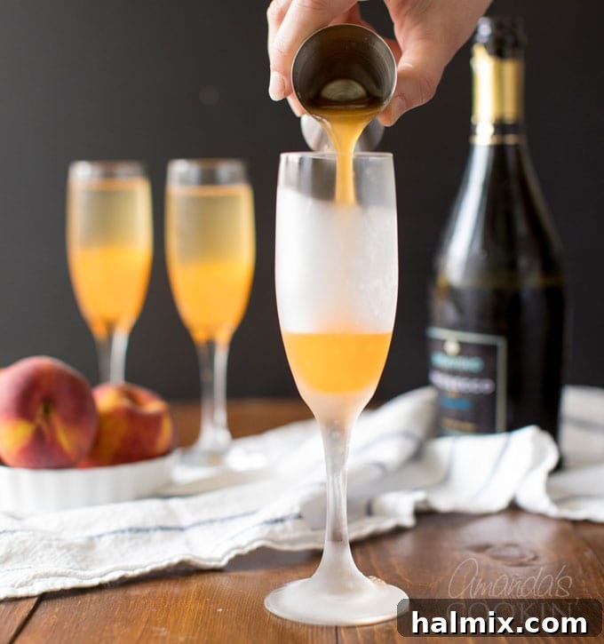 Carefully pouring rich peach puree into a champagne flute, the first step to creating a refreshing Bellini cocktail.