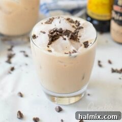 Mudslide cocktail with chocolate shavings on top in a rock glass