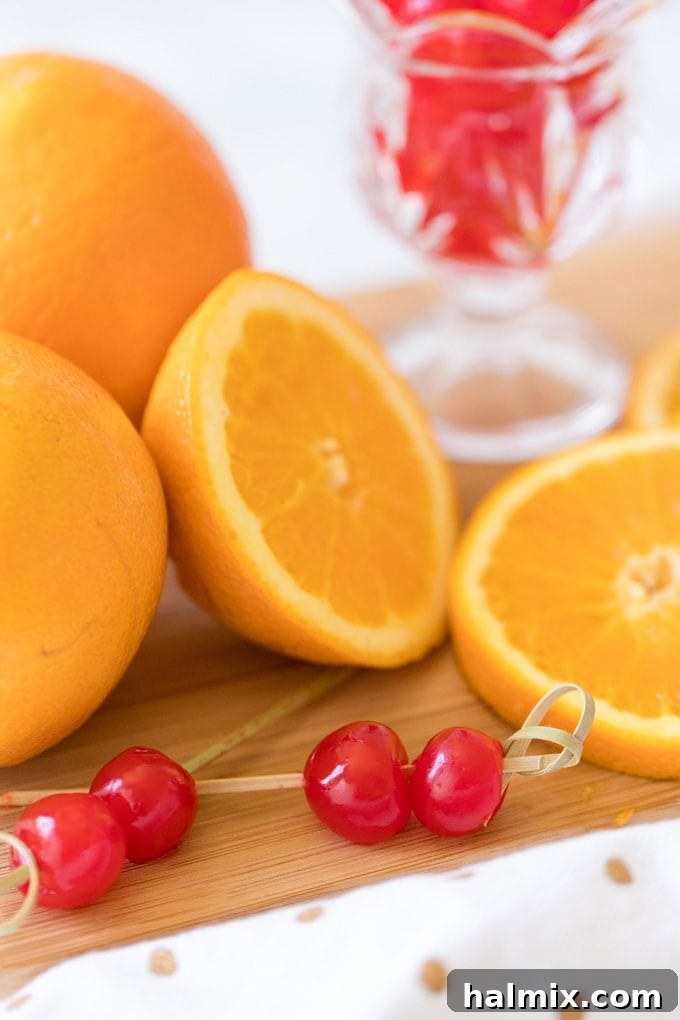 Maraschino cherries skewered on toothpicks with sliced oranges, ready for garnishing Tequila Sunrise.